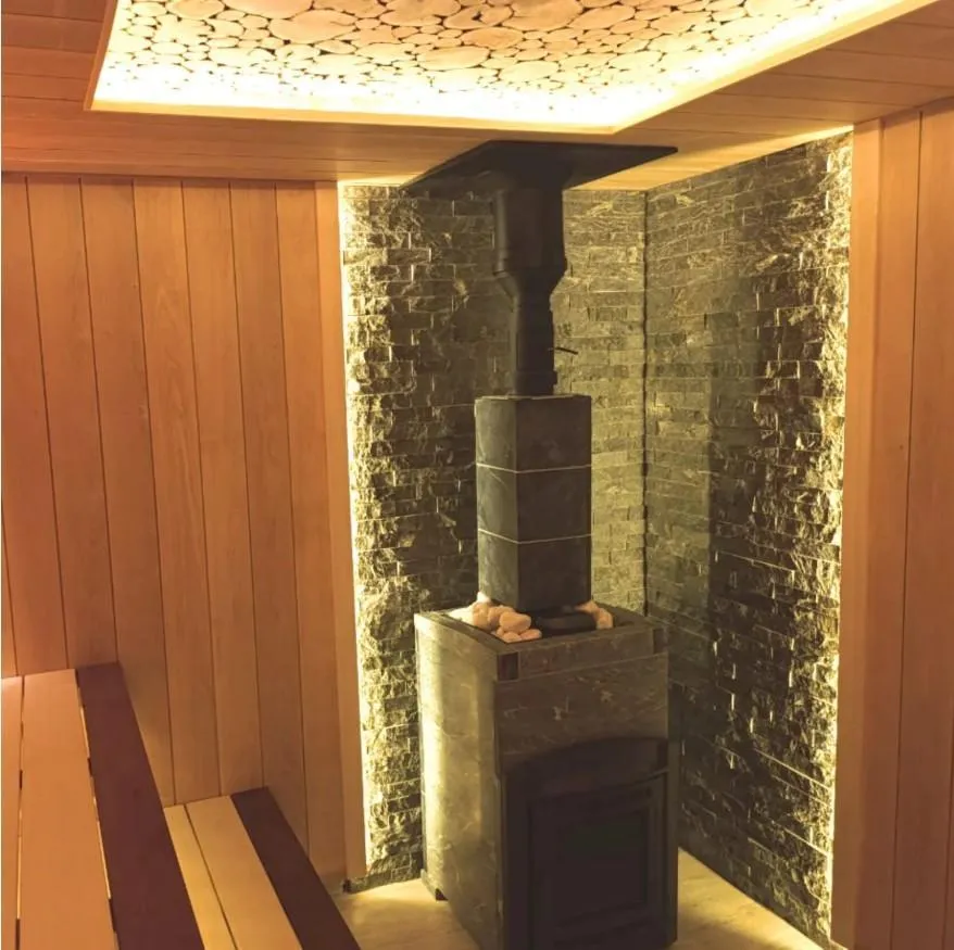 Чугунная банная печь Атмосфера L в облицовке «Талькохлорит»