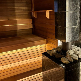 Чугунная банная печь Атмосфера XL в облицовке "Пироксенит Элит"